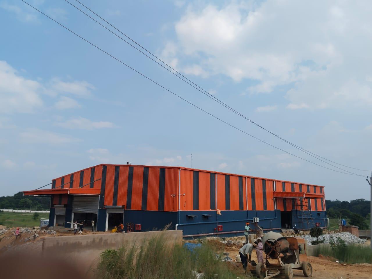 Wide exterior view of the Ranchi bottling facility during execution